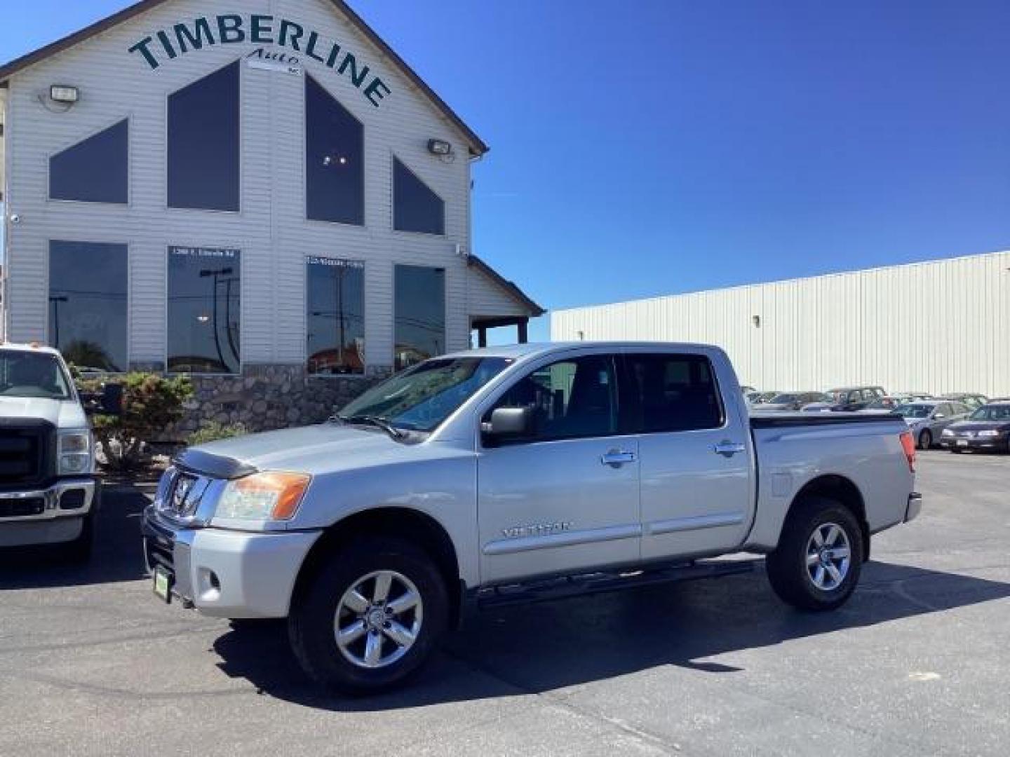 2009 Nissan Titan SE Crew Cab 4WD SWB (1N6AA07C29N) with an 5.6L V8 DOHC 32V engine, 5-Speed Automatic transmission, located at 1235 N Woodruff Ave., Idaho Falls, 83401, (208) 523-1053, 43.507172, -112.000488 - Photo#0