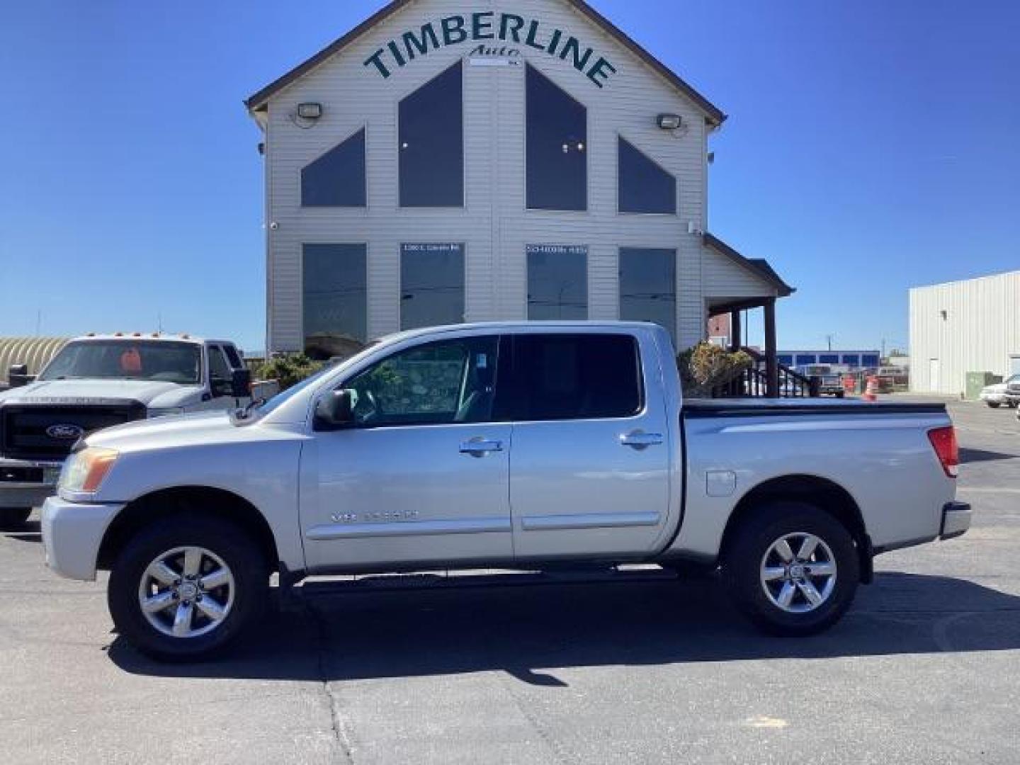 2009 Nissan Titan SE Crew Cab 4WD SWB (1N6AA07C29N) with an 5.6L V8 DOHC 32V engine, 5-Speed Automatic transmission, located at 1235 N Woodruff Ave., Idaho Falls, 83401, (208) 523-1053, 43.507172, -112.000488 - Photo#1