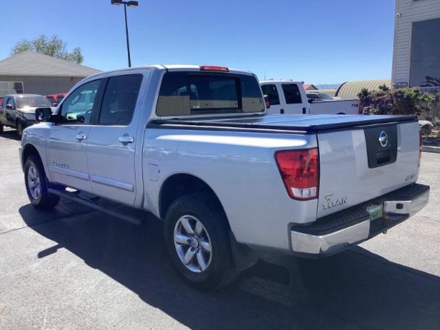 2009 Nissan Titan SE Crew Cab 4WD SWB (1N6AA07C29N) with an 5.6L V8 DOHC 32V engine, 5-Speed Automatic transmission, located at 1235 N Woodruff Ave., Idaho Falls, 83401, (208) 523-1053, 43.507172, -112.000488 - Photo#2